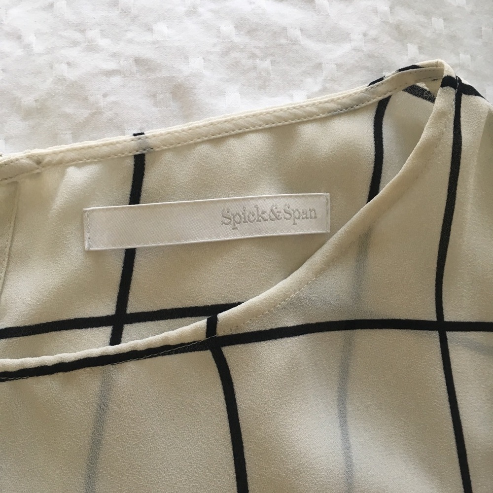 Black and white grid peplum sleeveless top - Picture 3 of 3